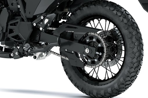 Rear wheel of a motorcycle staged in a white studio background. opens in a new window