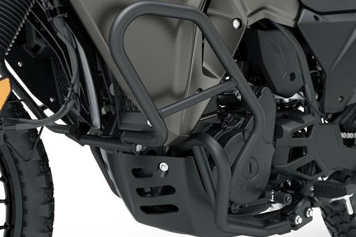 Side of engine of a motorcycle staged in a white studio background. opens in a new window