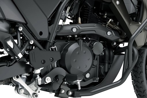 Engine of a motorcycle staged in a white studio background. opens in a new window