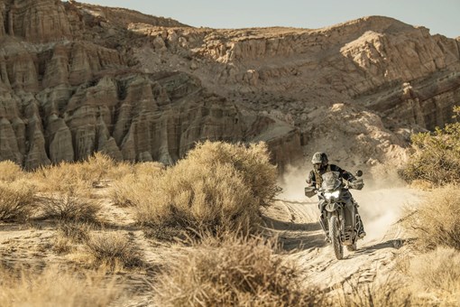 Front angle of a person riding a motorcycle off-road. opens in a new window