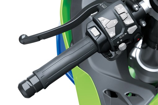 Close-up of the handlebar of a motorcycle staged in a white studio background. opens in a new window