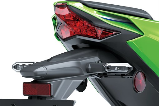 Close-up of the rear fender of a motorcycle staged in a white studio background. opens in a new window