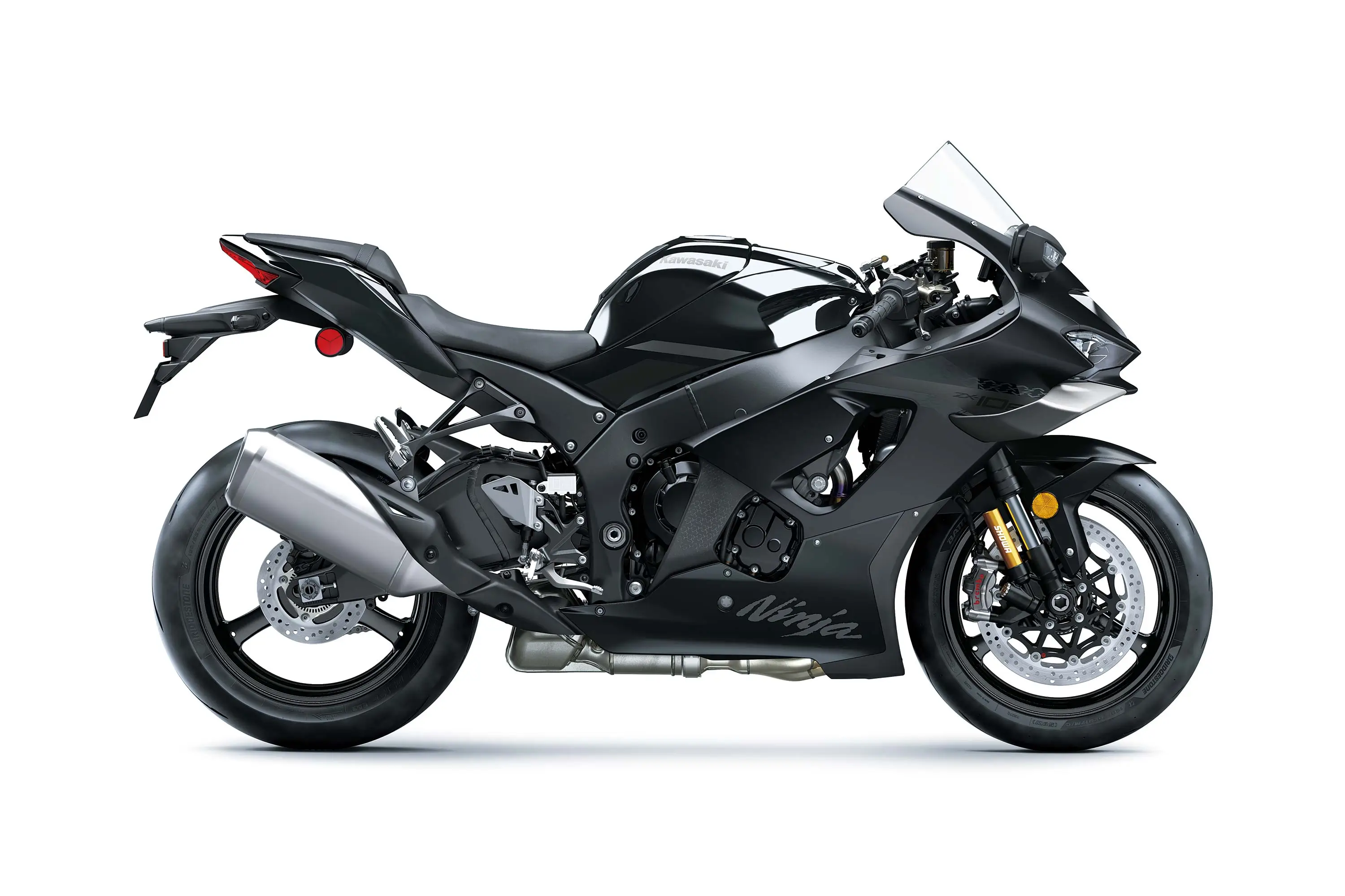 Side angle of a black motorcycle staged in a white studio background.