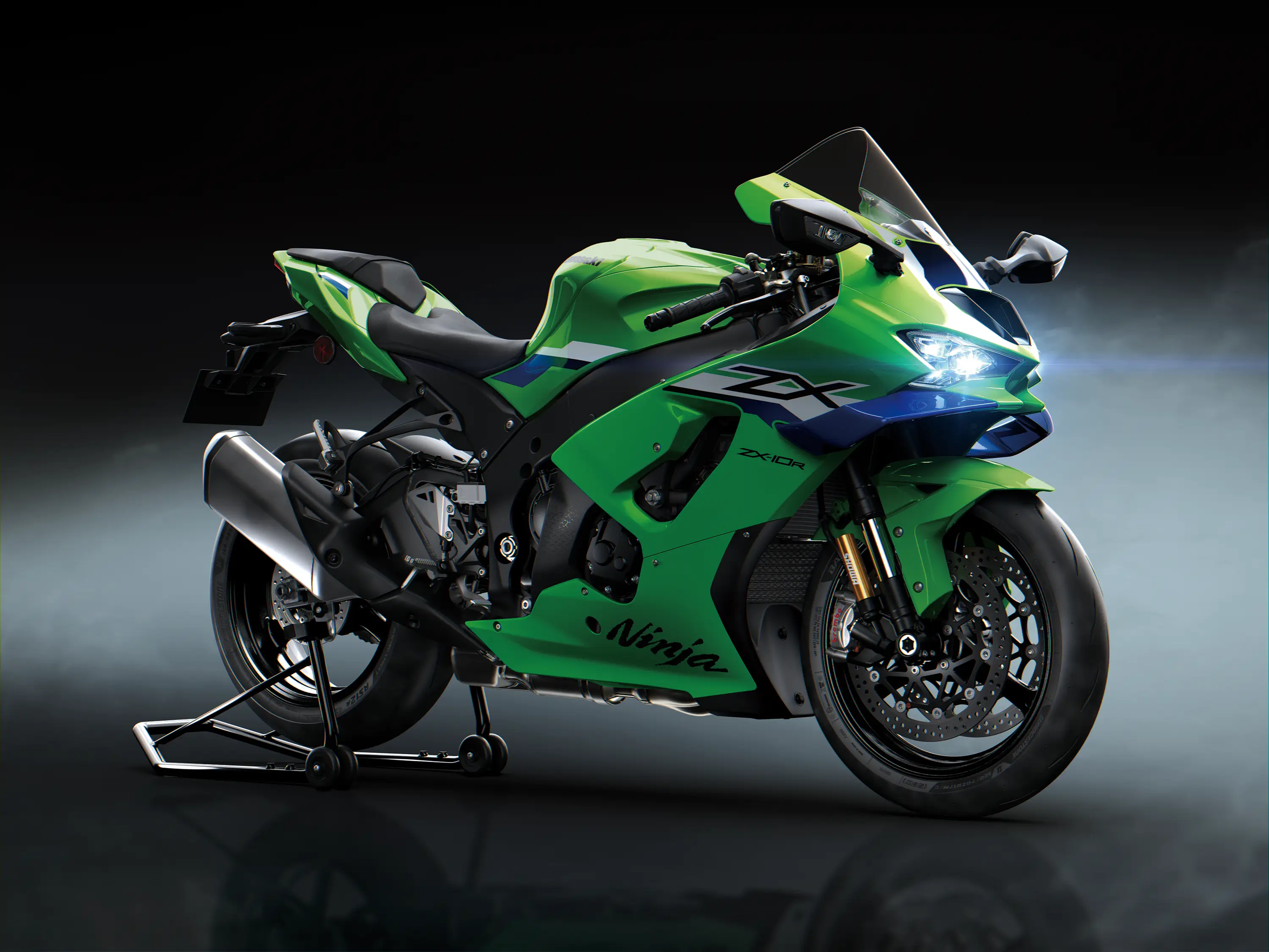 Three-quarter front angle of a motorcycle staged in a black studio background.