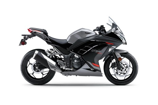 Profile angle of a grey motorcycle staged in a white studio background. opens in a new window