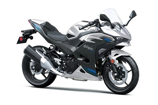 Three-quarter front angle of a silver motorcycle staged in a white studio background. opens in a new window
