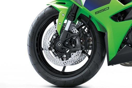 Front wheel of a motorcycle staged in a white studio background. opens in a new window