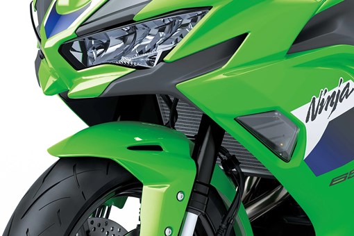 Front closeup of a motorcycle staged in a white studio background. opens in a new window