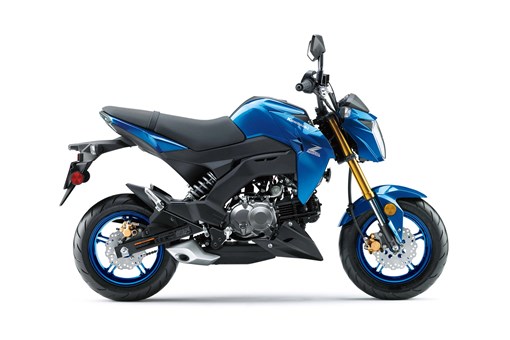Side angle of a blue motorcycle staged in a white studio background. opens in a new window
