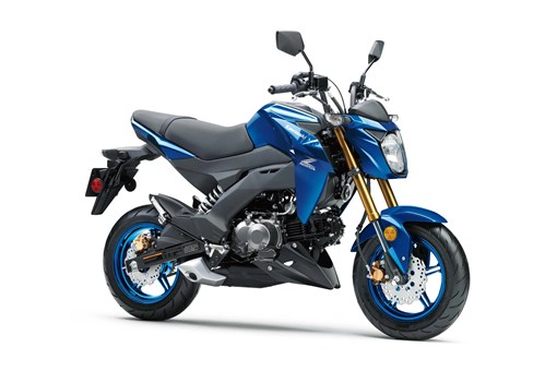 Three-quarter front angle of a blue motorcycle staged in a white studio background. opens in a new window