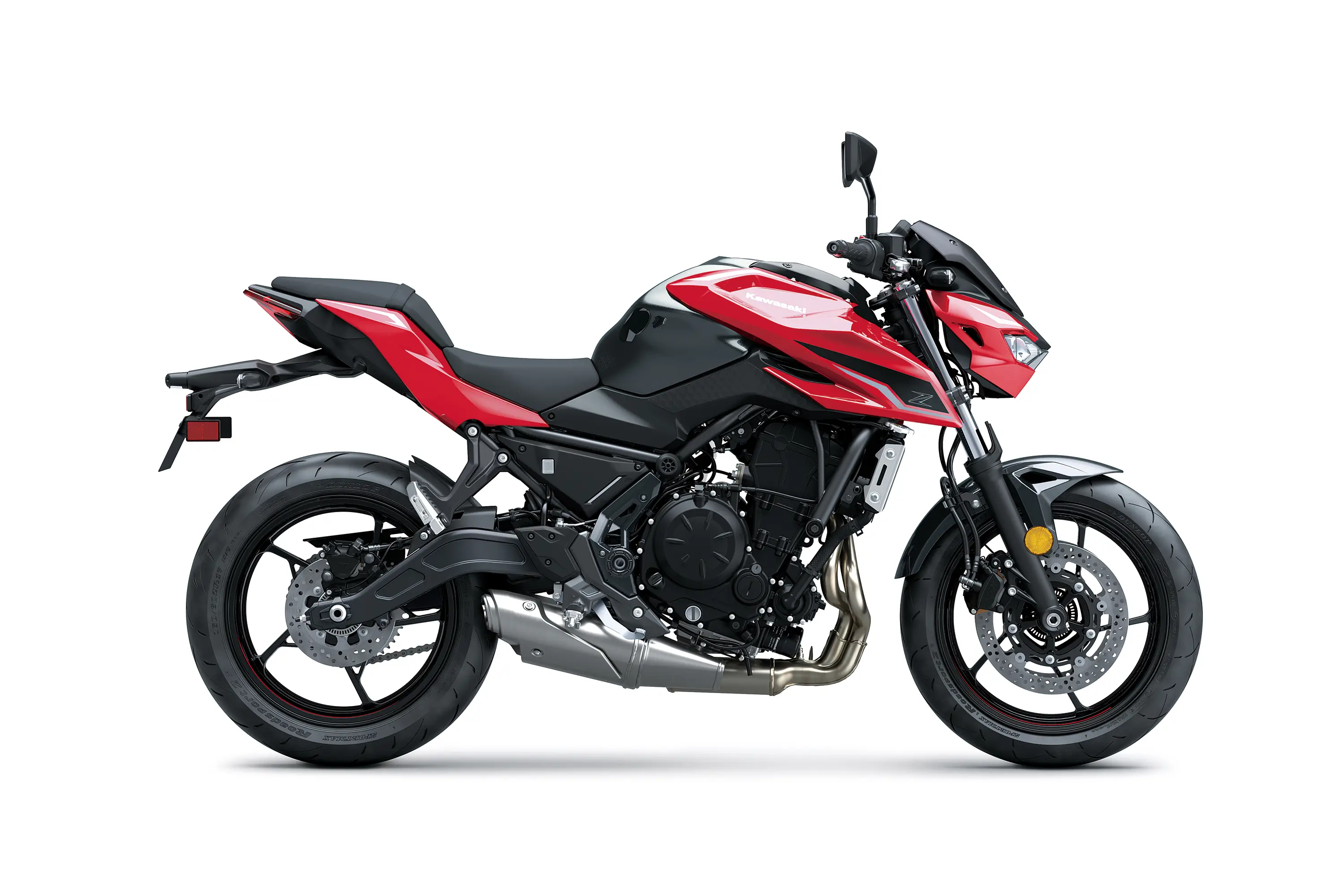 Profile angle of a red motorcycle staged in a white studio background.
