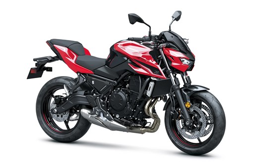 Three-quarter front angle of a red motorcycle staged in a white studio background. opens in a new window