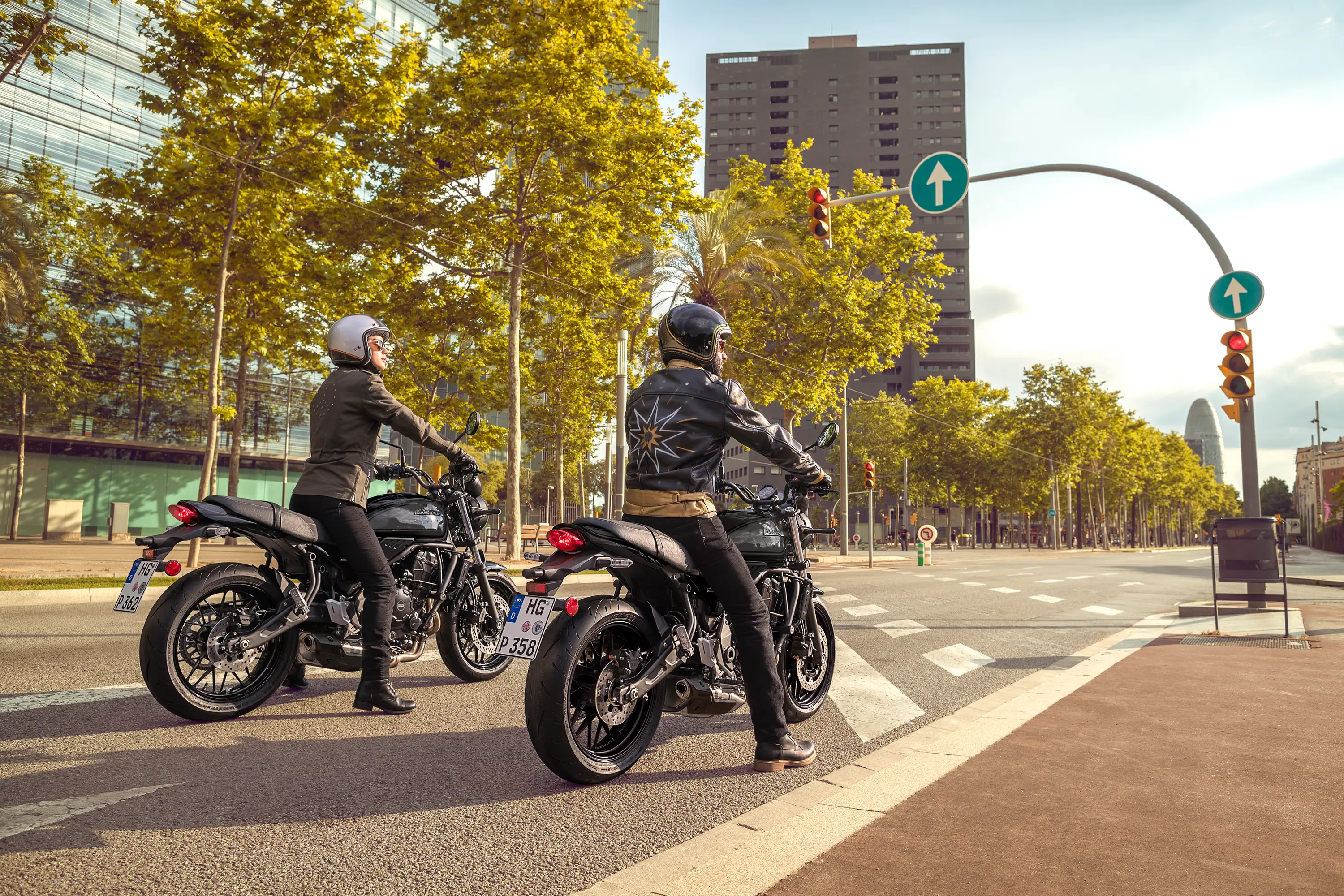 Rear angle of people riding a motorcycle on the street.