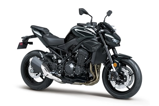 Three-quarter front angle of a black motorcycle staged in a white studio background. opens in a new window