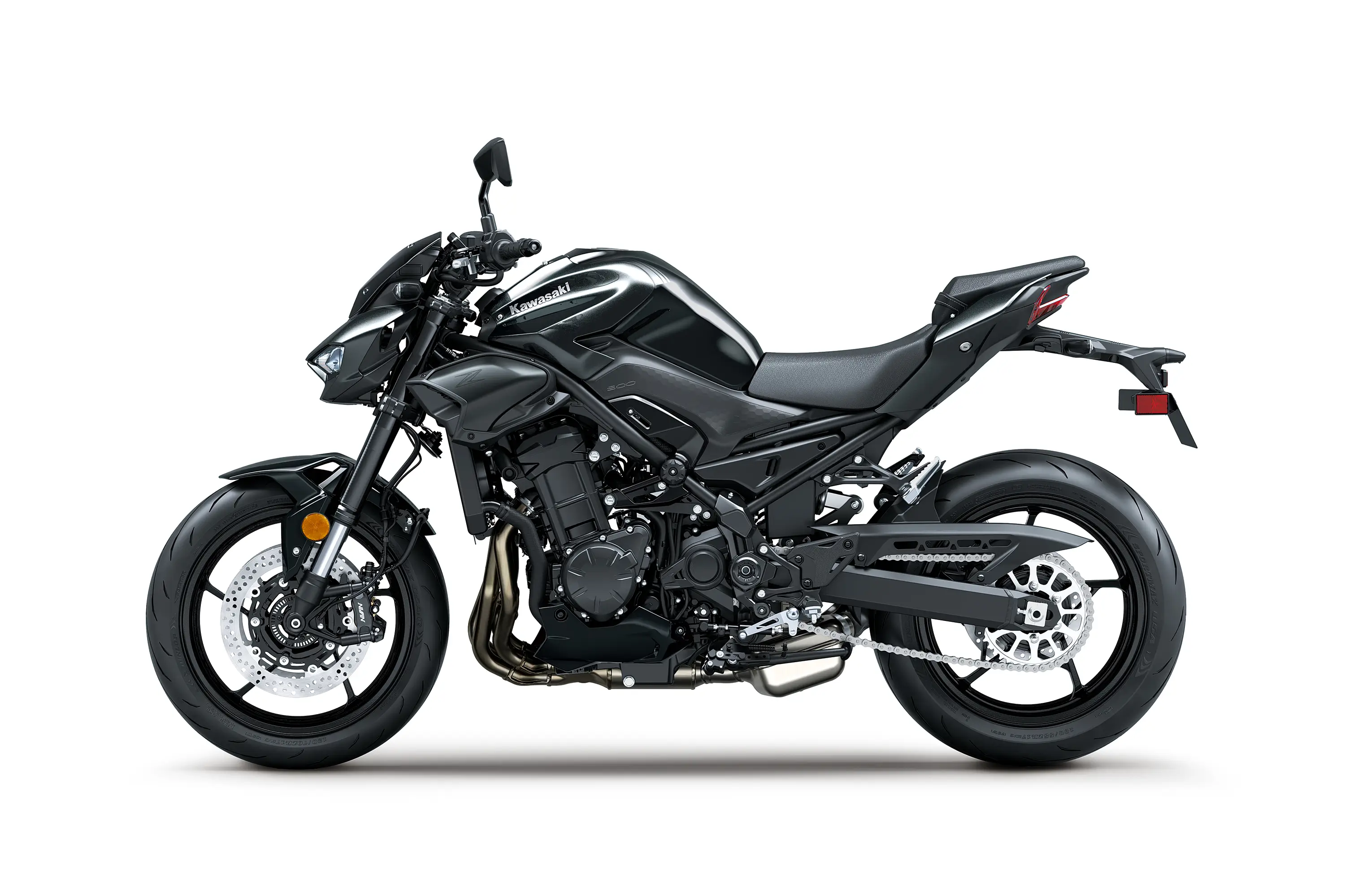 Side angle of a black motorcycle with white accents staged in a white studio background.