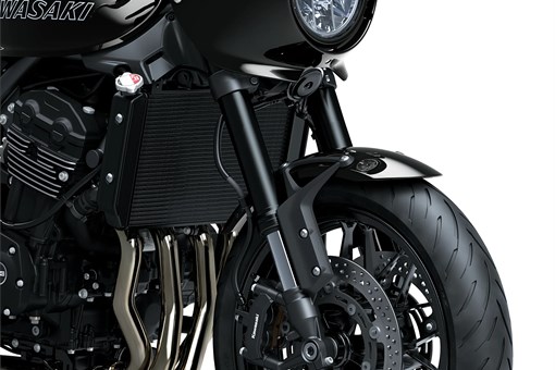 Close-up of the front-end of a motorcycle staged in a white studio background. opens in a new window
