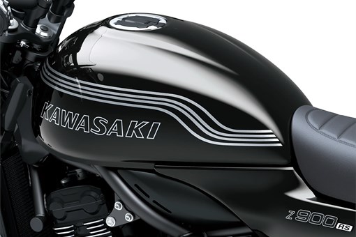 Close-up of the fuel tank of a motorcycle staged in a white studio background. opens in a new window