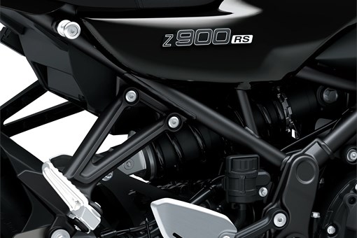 Close-up of the framing of a motorcycle staged in a white studio background. opens in a new window