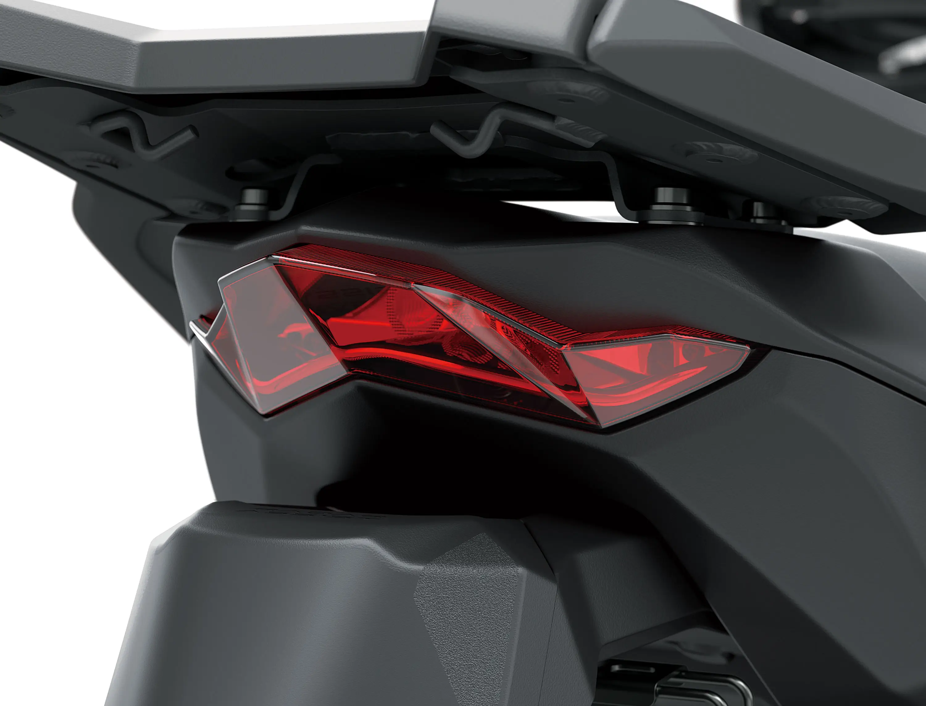 Taillight of a motorcycle staged in a white studio background.