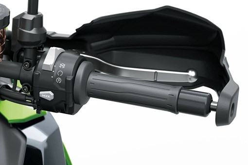 Right handlebar of a motorcycle staged in a white studio background. opens in a new window
