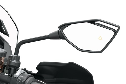 Mirror of a motorcycle staged in a white studio background. opens in a new window
