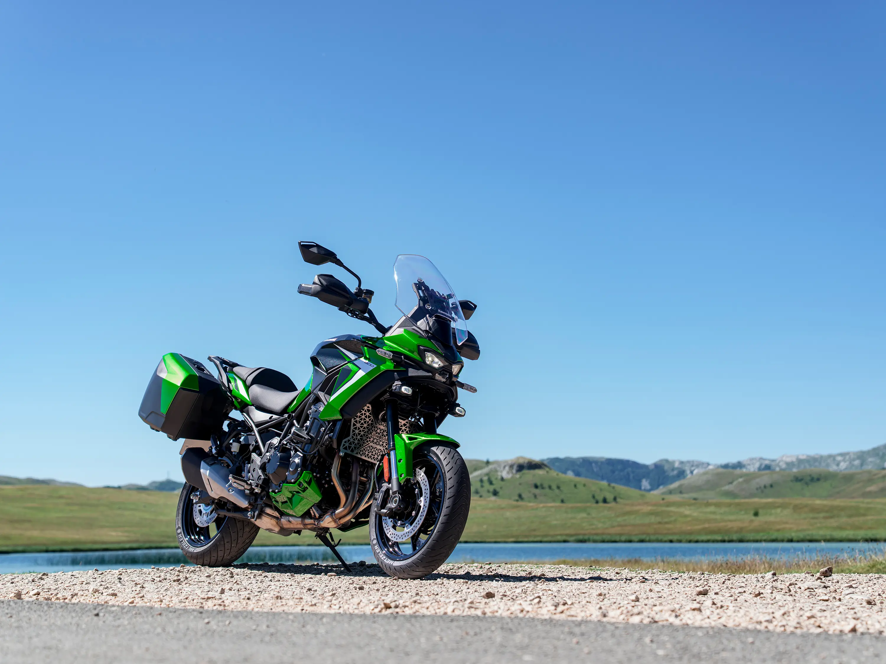 Three-quarter front angle of a motorcycle parked near water.