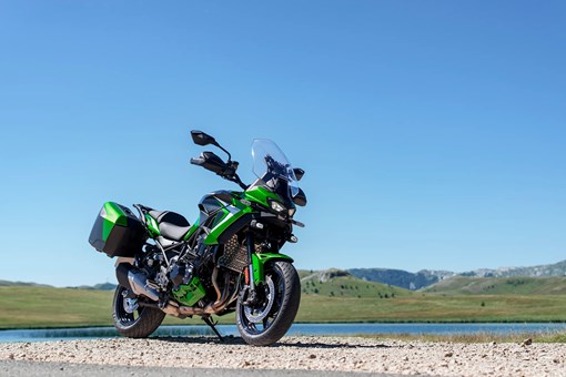 Three-quarter front angle of a motorcycle parked near water. opens in a new window