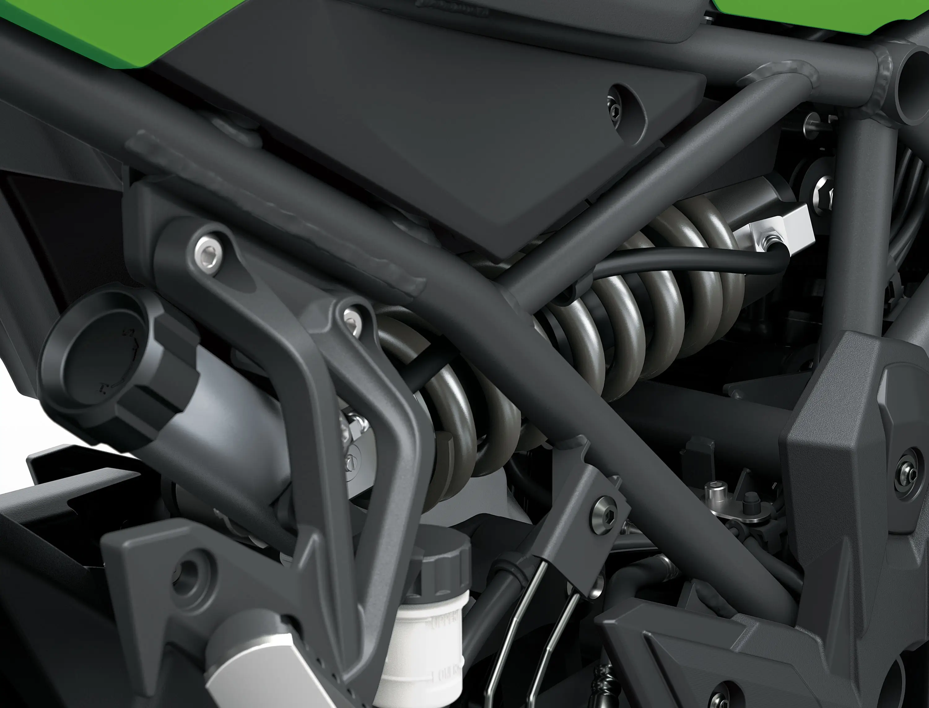 Mechanical detail of a motorcycle staged in a white studio background.