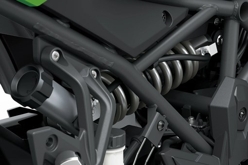 Mechanical detail of a motorcycle staged in a white studio background. opens in a new window