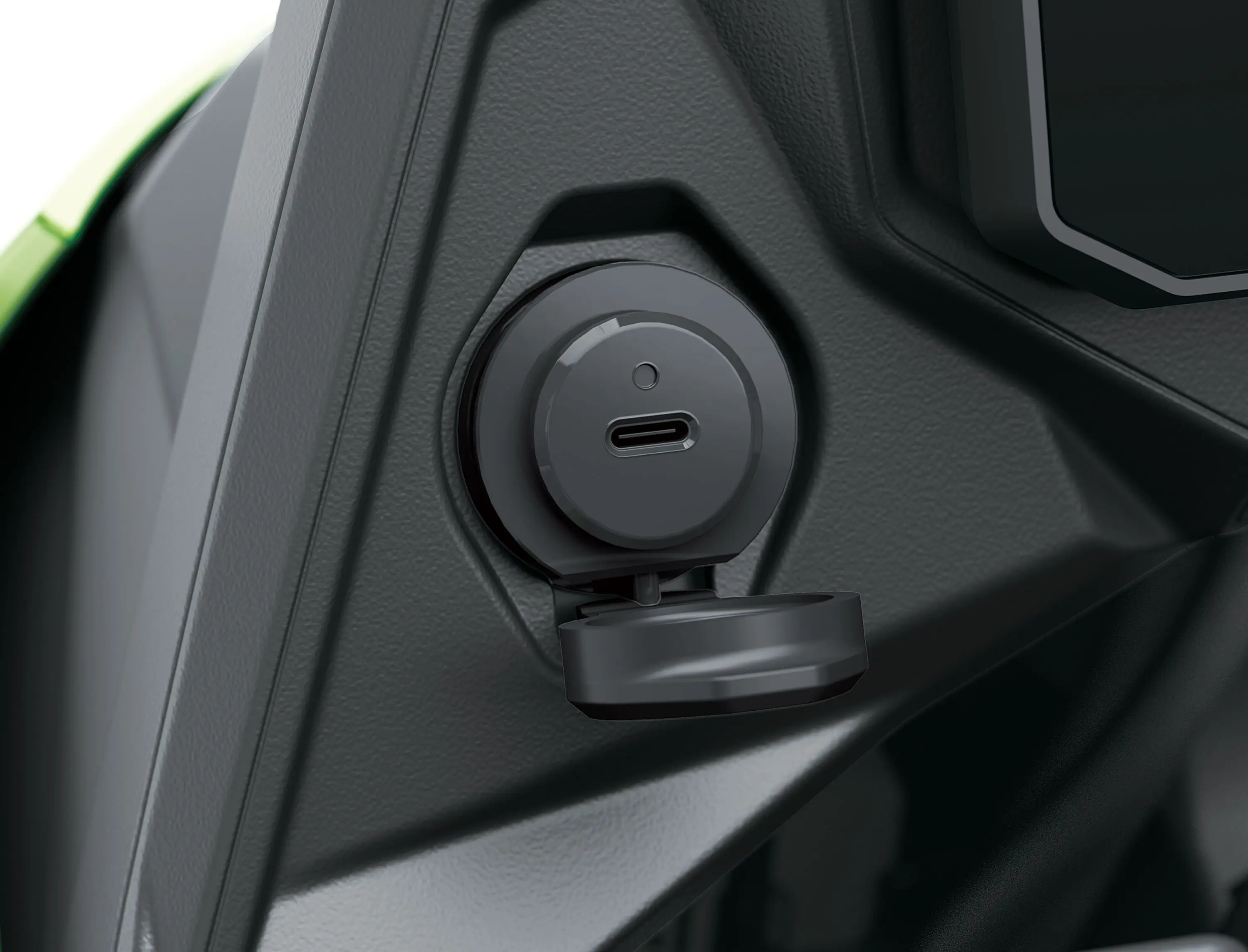 Charging port of a motorcycle staged in a white studio background.