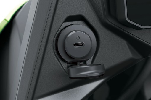 Charging port of a motorcycle staged in a white studio background. opens in a new window