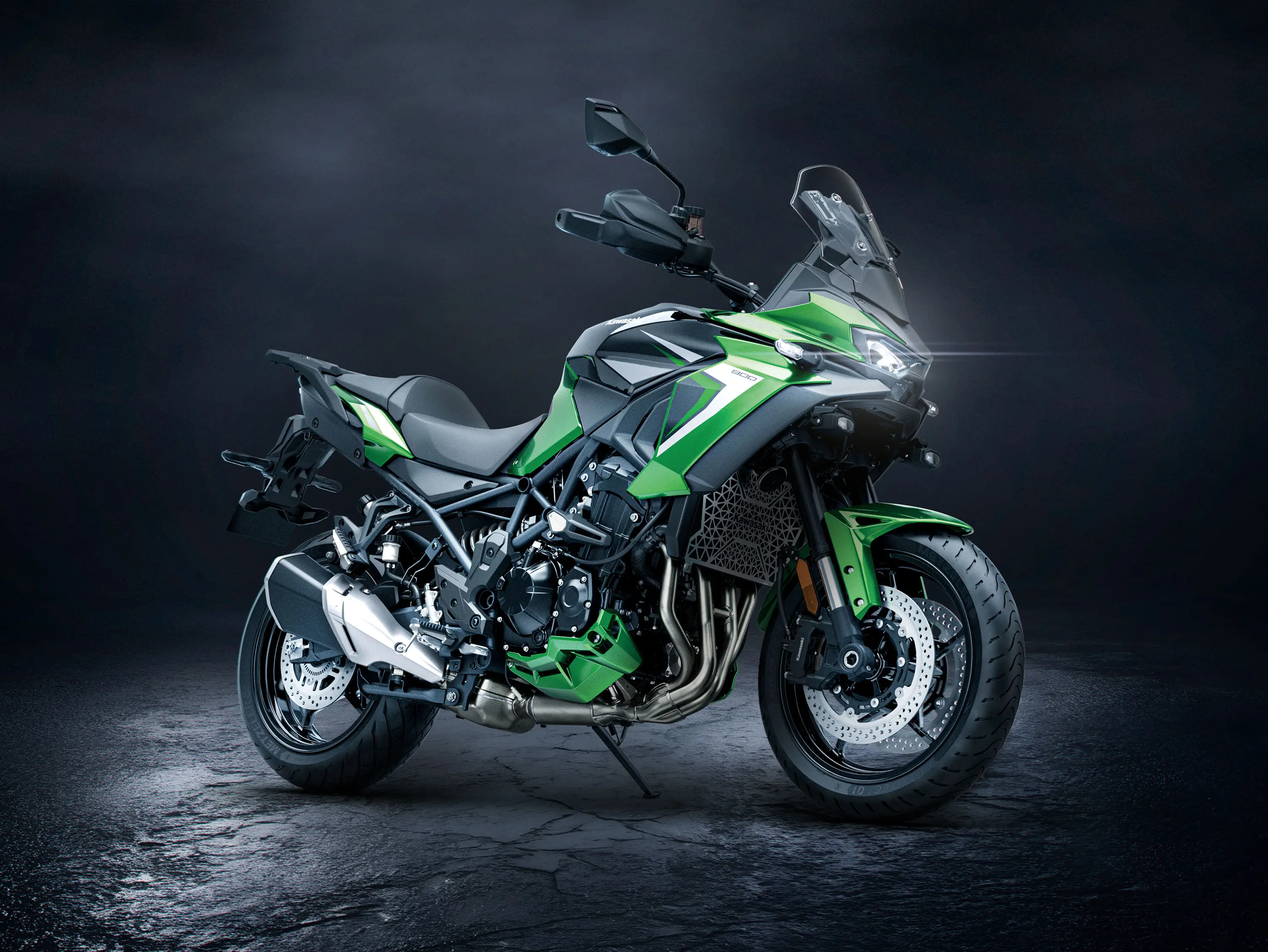 Side angle of a motorcycle staged in a black studio background.
