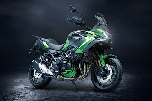 Side angle of a motorcycle staged in a black studio background. opens in a new window