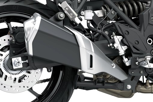 Exhaust of a motorcycle staged in a white studio background. opens in a new window