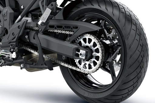 Rear wheel of a motorcycle staged in a white studio background. opens in a new window