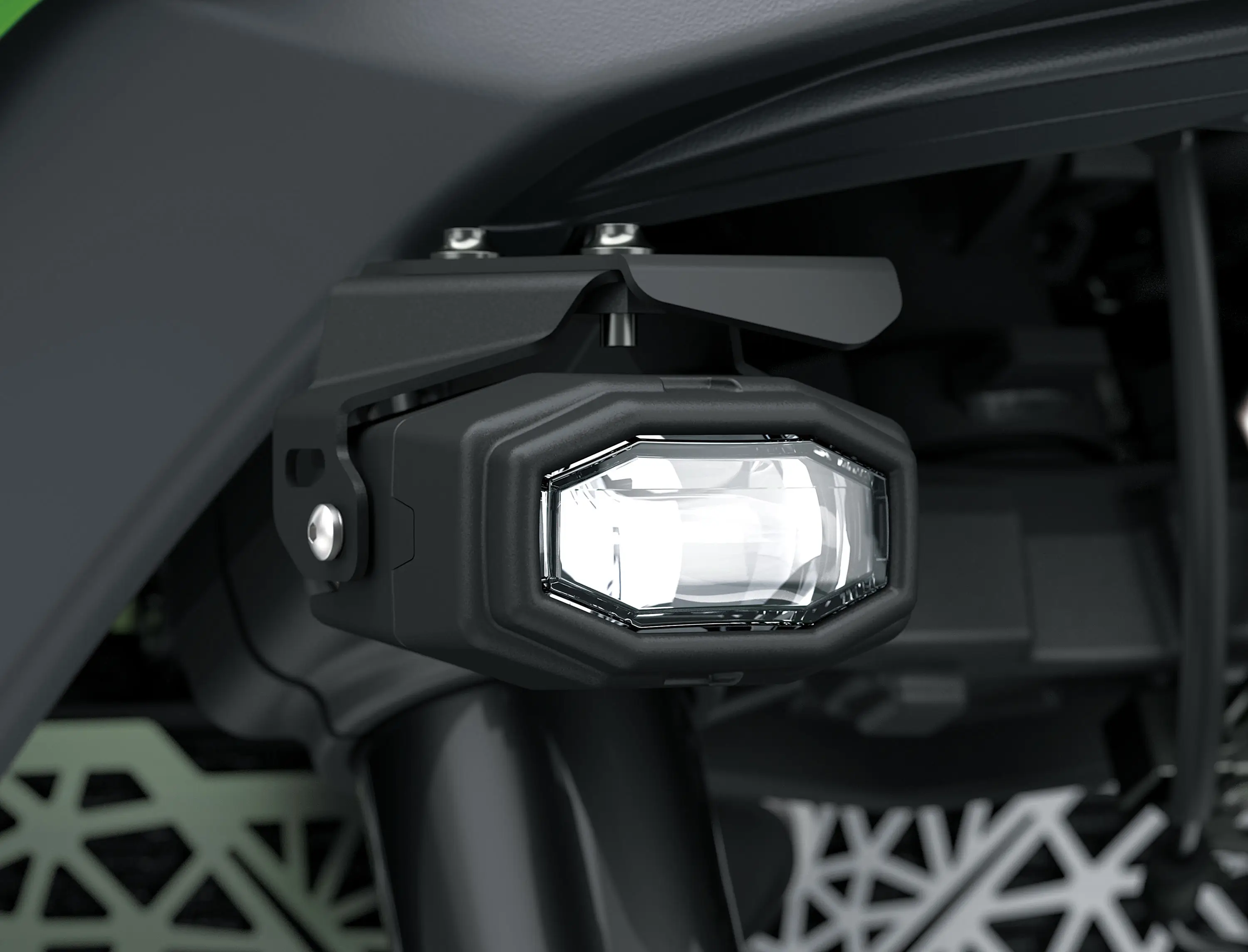 Light of a motorcycle staged in a white studio background.