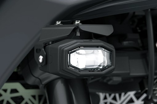 Light of a motorcycle staged in a white studio background. opens in a new window