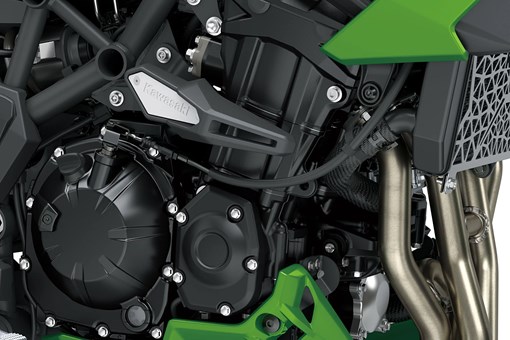 Engine of a motorcycle staged in a white studio background. opens in a new window