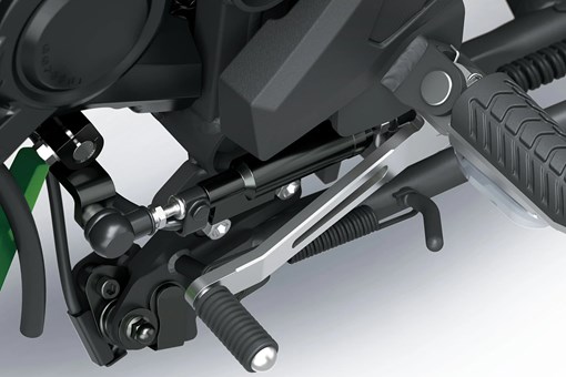 Detail of a motorcycle staged in a white studio background. opens in a new window
