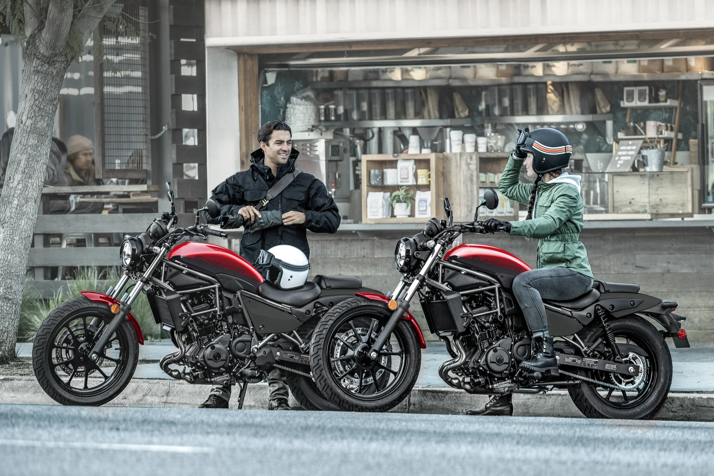 Side angle of two motorcycles parked.