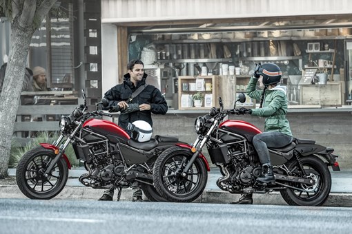 Side angle of two motorcycles parked. opens in a new window