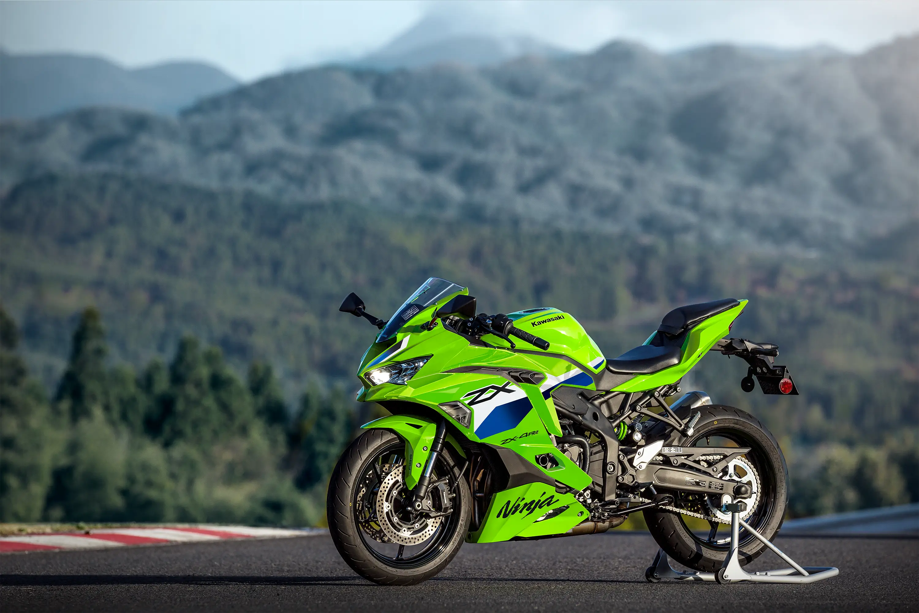 Side angle of a motorcycle staged on a racetrack.