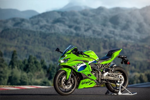 Side angle of a motorcycle staged on a racetrack. opens in a new window
