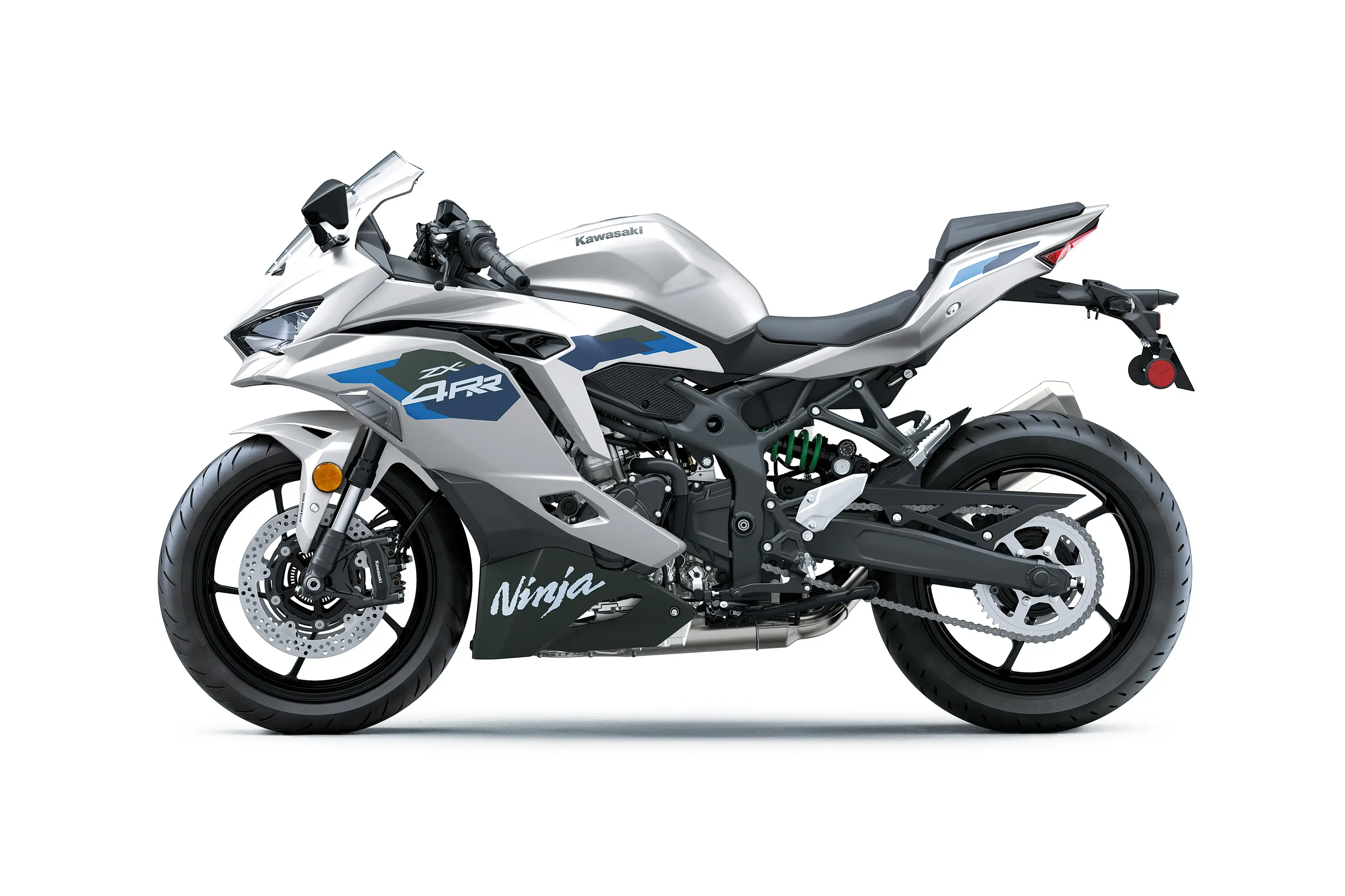 Side angle of a silver motorcycle staged in a white studio background.