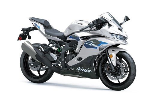 Three-quarter front angle of a silver motorcycle staged in a white studio background. opens in a new window