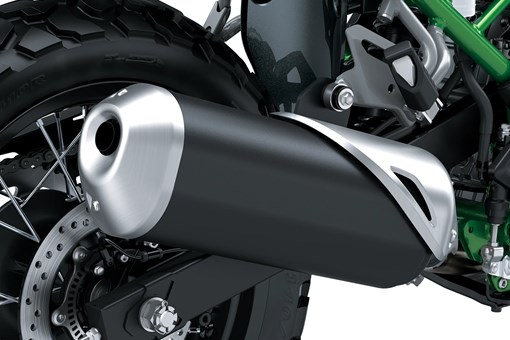 Exhaust pipe of a motorcycle staged in a white studio background. opens in a new window