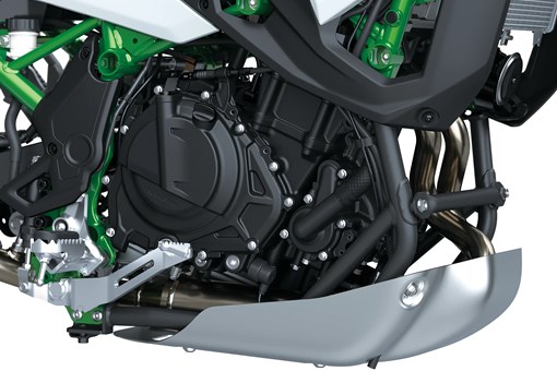 Closeup on engine of a motorcycle staged in a white studio background. opens in a new window