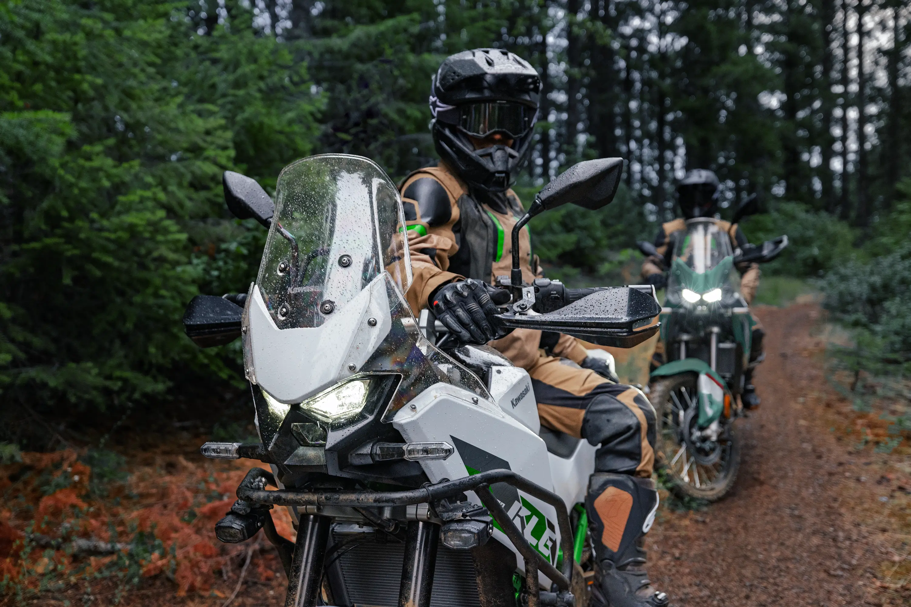 Three-quarter front angle of two motorcycles parked.