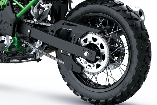 Closeup of a rear wheel of a motorcycle staged in a white studio background. opens in a new window