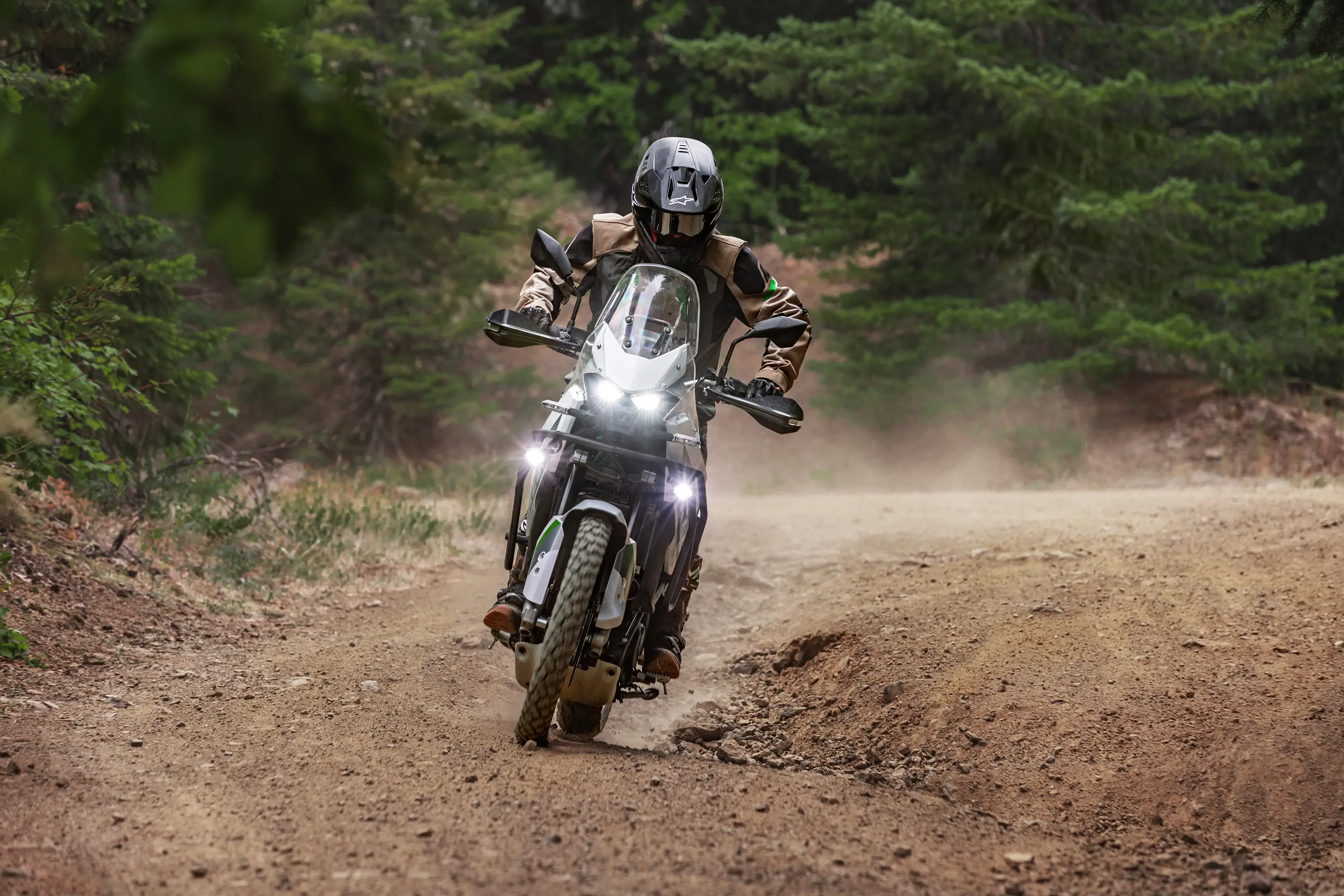 Front angle of a person riding a motorcycle off-road.